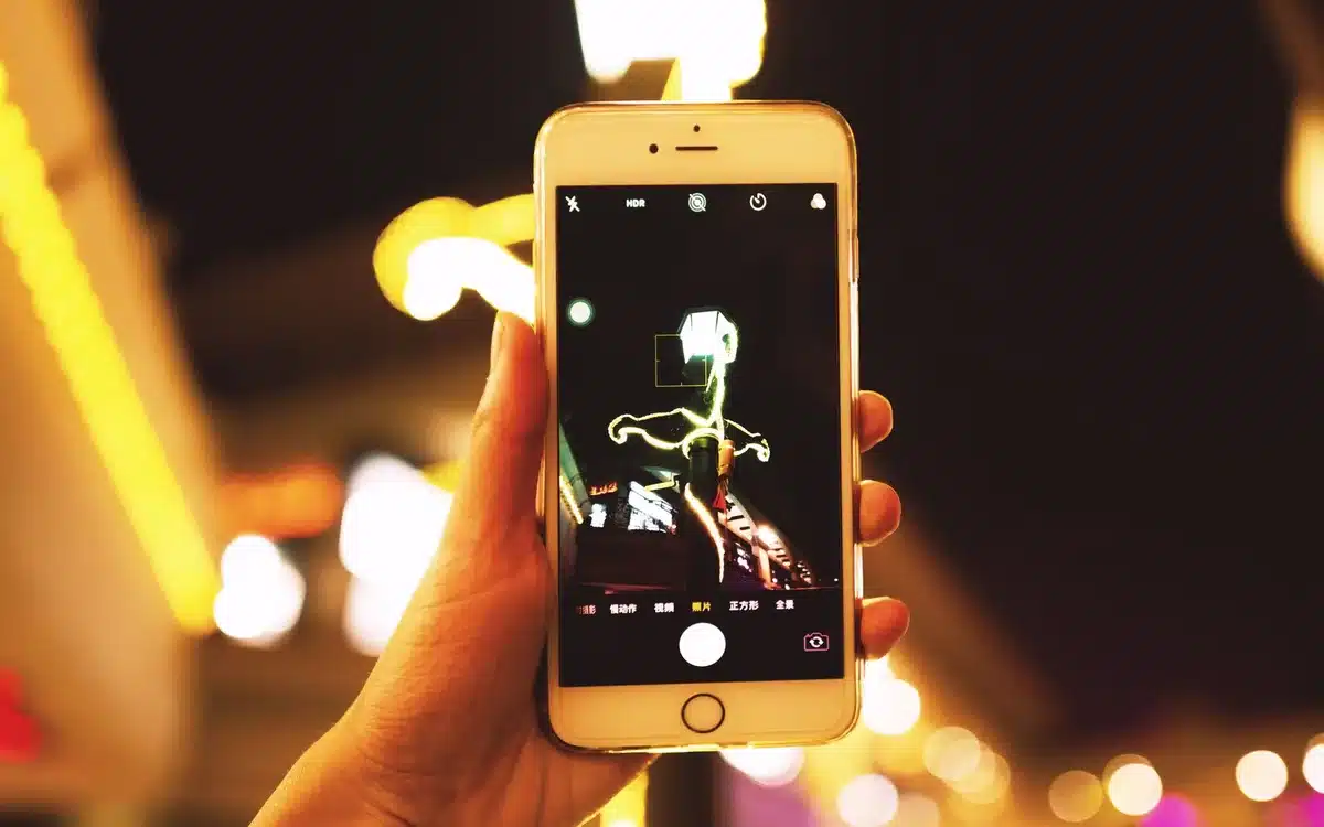 Professional video creation interface with text-to-video controls, showing a smartphone screen with animation settings and preview of AI-generated content