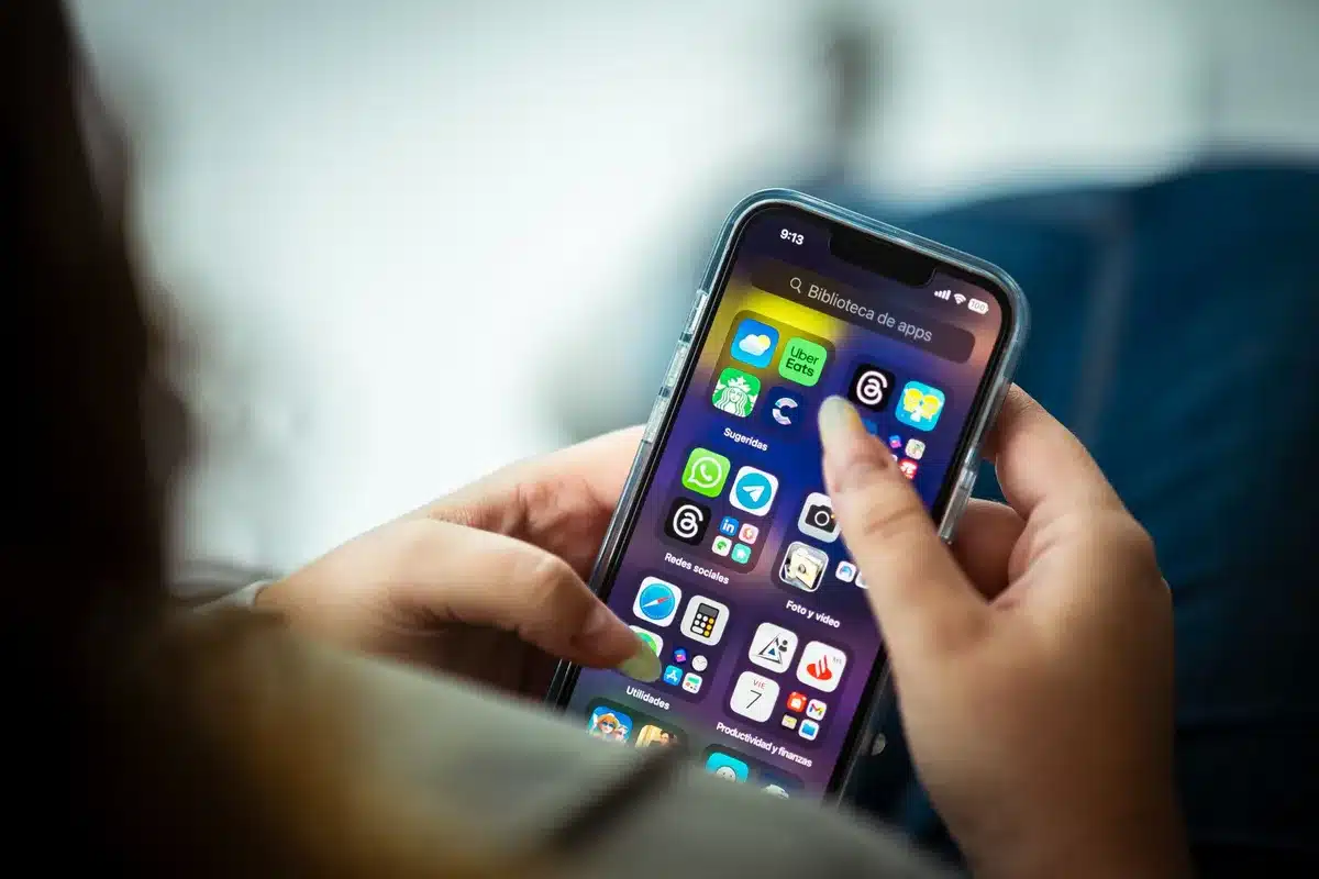 iPhone home screen with App Store open, multiple call blocking app icons visible including Truecaller, Hiya, and Call Control in search results.
