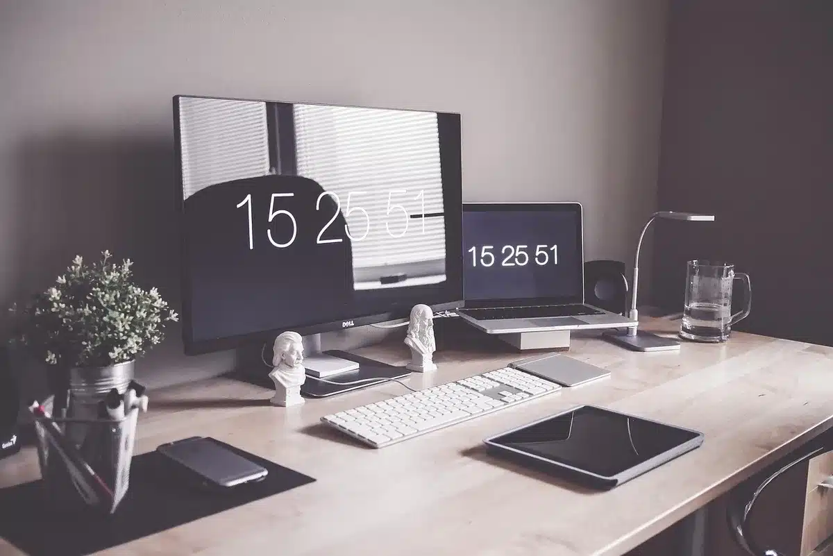 A sleek gaming laptop with RTX 50 GPU displayed on a desk in a university study environment, surrounded by textbooks, notebooks, and design software open on screen, emphasizing versatility for both academics and creative work