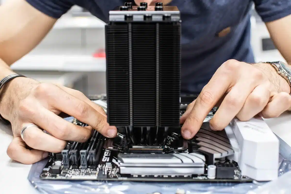 A professional workstation rendering farm setup, multiple high-core-count CPUs in server-class form factor, cooling towers and LED indicators visible, warm industrial lighting