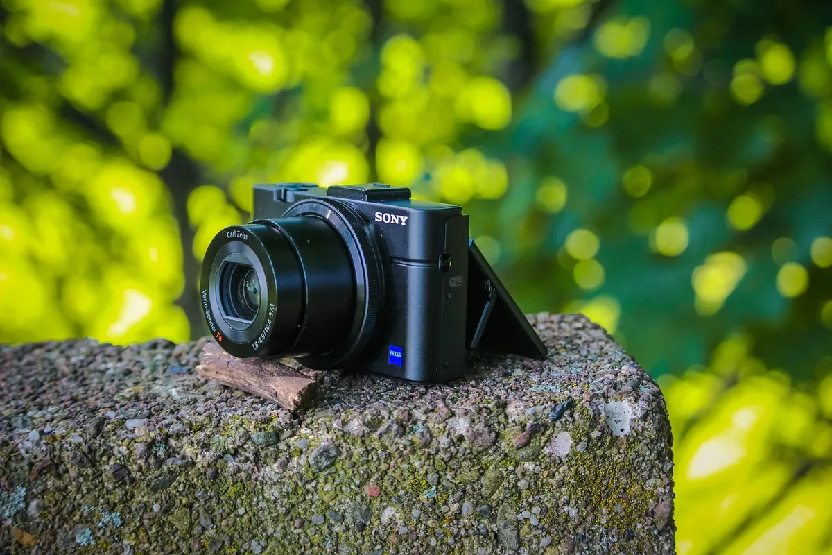Close-up of a modern smartphone camera lens reflecting light, with blurred bokeh background, representing computational photography capabilities