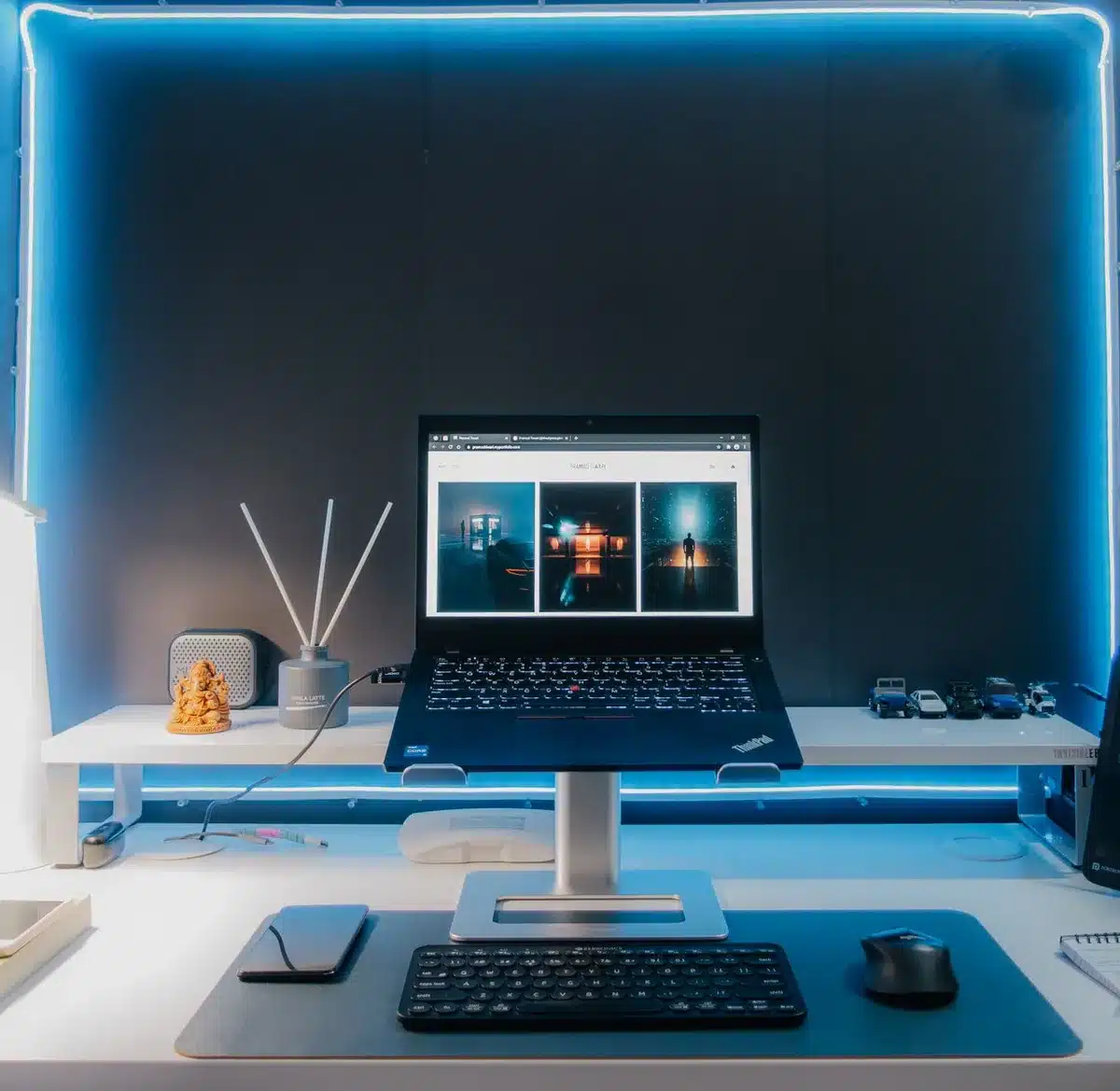 empty modern laptop on a clean desk with soft natural light, anonymous hands reaching toward it