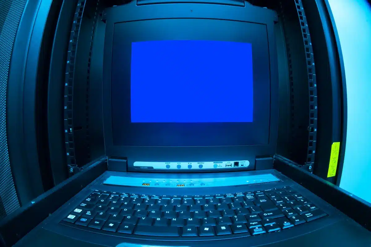 anonymous hands typing on a laptop keyboard with a terminal window showing 'ollama run qwen3.8', small external GPU visible in background; intimate POV, no faces