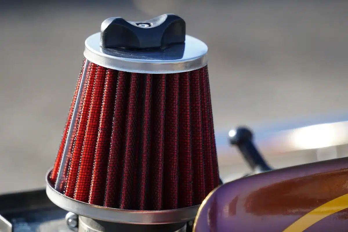 close-up of a projector ventilation grille and a small toolkit beside it